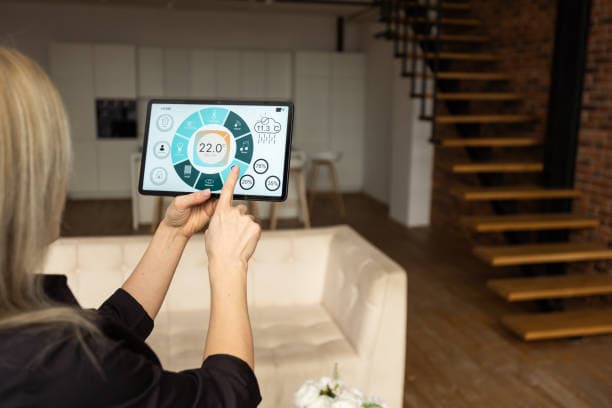 Homeowner using a tablet to configure and control their smart home system