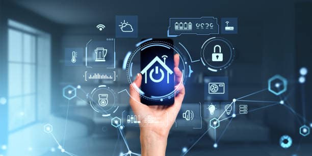 Hand holding smartphone with smart home control interface and connected home icons