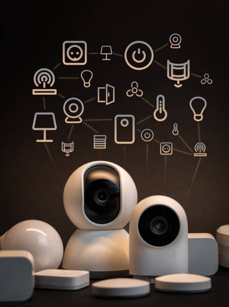 Hand holding a smartphone with smart home control icons and device integration